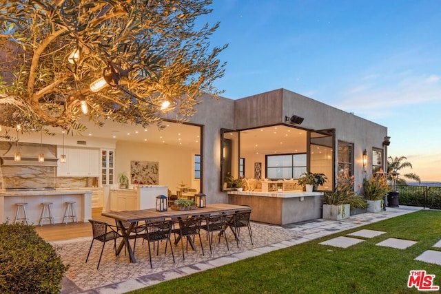 exterior space featuring an outdoor bar