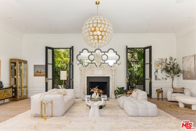 living room featuring crown molding and light hardwood / wood-style floors