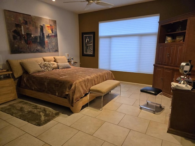 tiled bedroom featuring ceiling fan