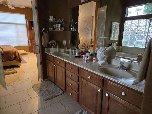 bathroom with ceiling fan, tile patterned floors, and vanity