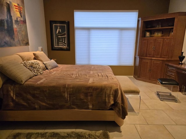 bedroom with light tile patterned floors