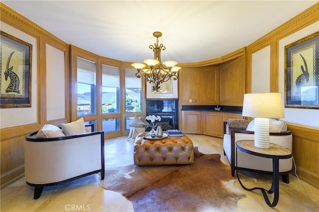 living room with wooden walls and a notable chandelier