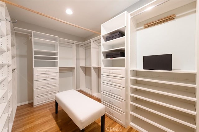 walk in closet featuring light hardwood / wood-style floors