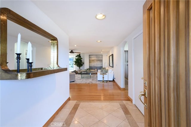 corridor with light tile patterned floors