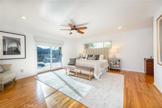 bedroom with access to exterior, ceiling fan, and light hardwood / wood-style flooring