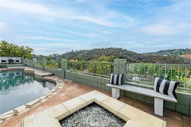 view of patio / terrace with a fenced in pool