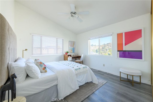 bedroom featuring hardwood / wood-style flooring, ceiling fan, and vaulted ceiling