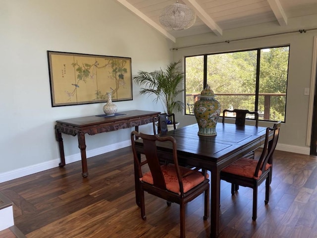 dining room featuring dark wood-type flooring and vaulted ceiling with beams