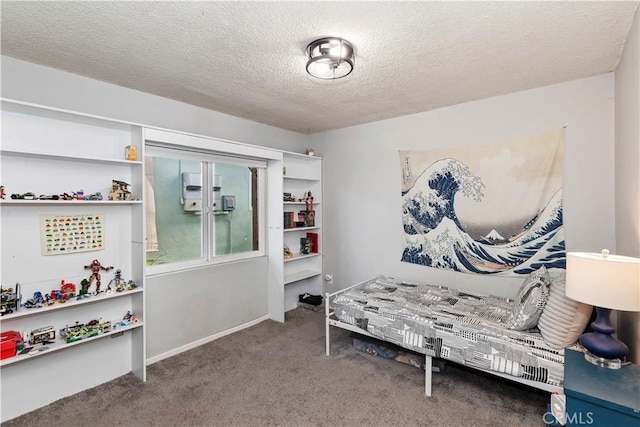 carpeted bedroom featuring a textured ceiling