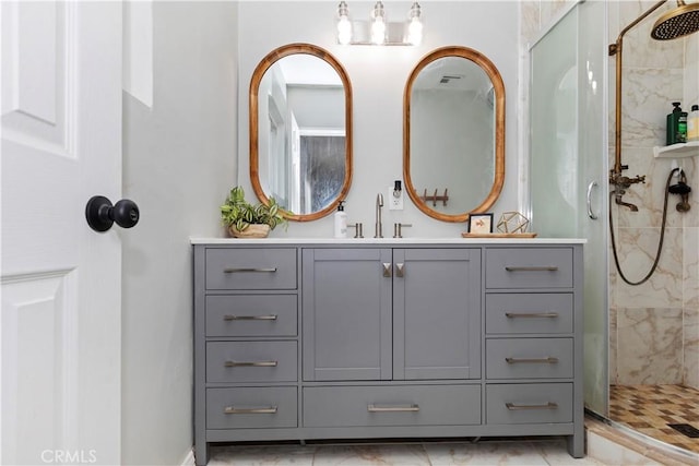 bathroom featuring vanity and tiled shower