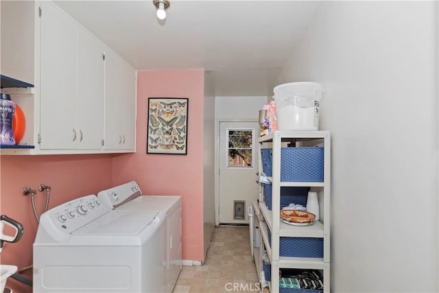 washroom with independent washer and dryer and cabinets