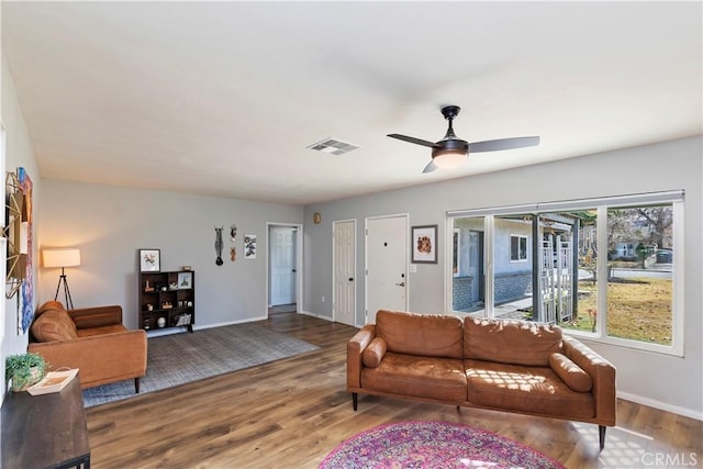 living room with ceiling fan and wood-type flooring