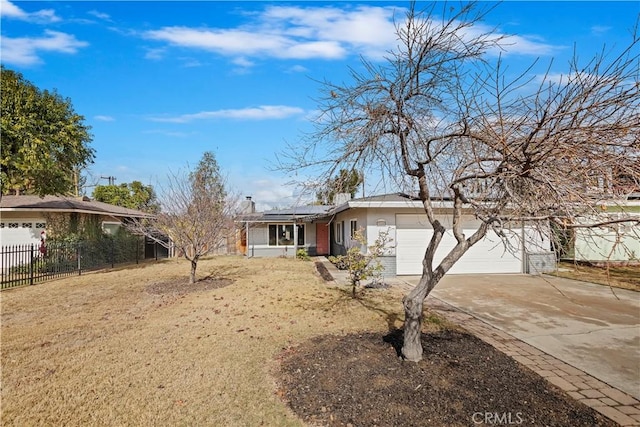 ranch-style home with a garage and a front yard