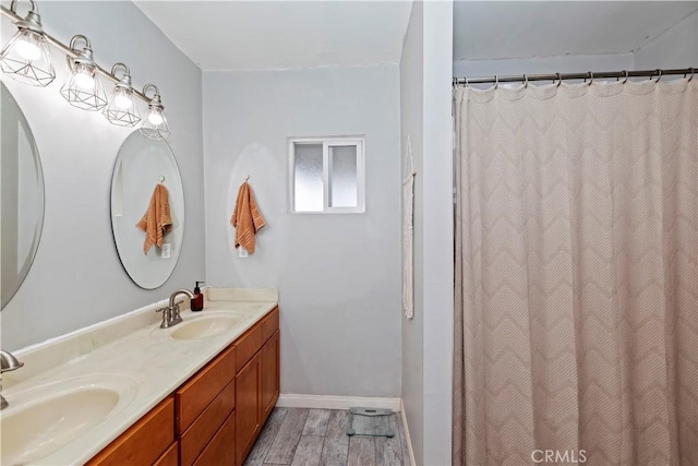 bathroom with a shower with curtain and vanity