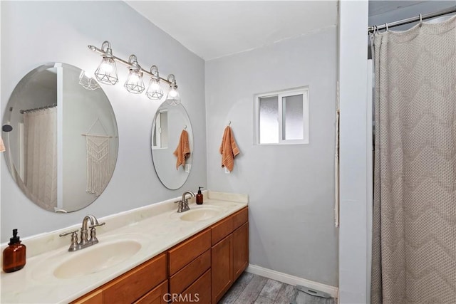 bathroom featuring a shower with curtain, vanity, and hardwood / wood-style floors