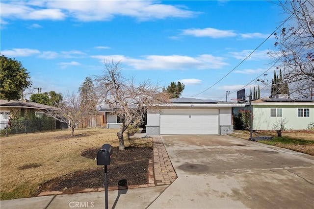 ranch-style home featuring a garage, a front lawn, and solar panels