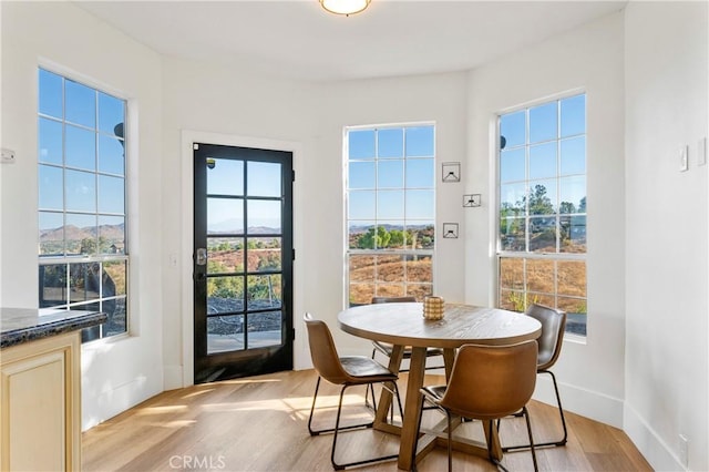 dining area with light wood-type flooring