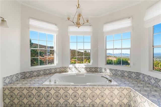 bathroom featuring crown molding and plenty of natural light