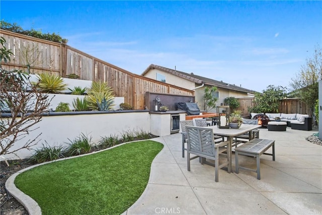 view of patio with a grill and an outdoor hangout area