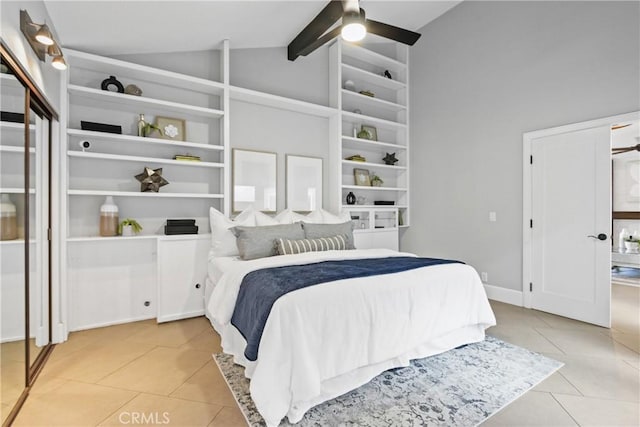 bedroom featuring vaulted ceiling with beams, light tile patterned floors, and ceiling fan