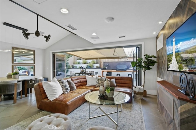 living room featuring lofted ceiling