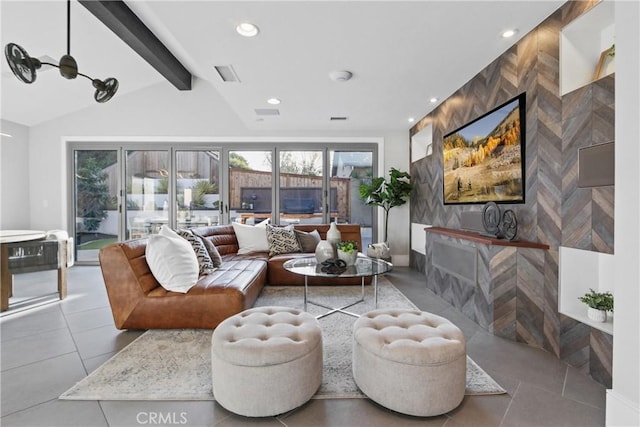 living room with tile walls and lofted ceiling with beams