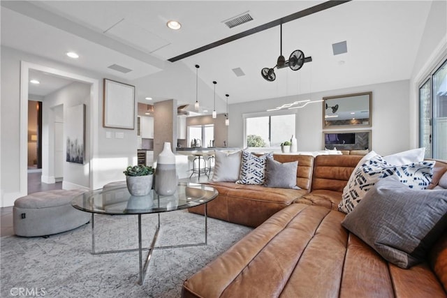 living room featuring high vaulted ceiling