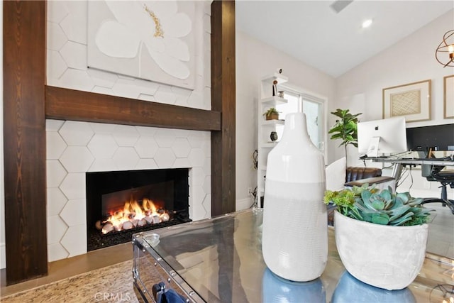 interior space featuring a fireplace and vaulted ceiling