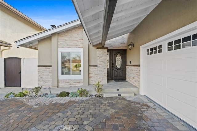 doorway to property featuring a garage