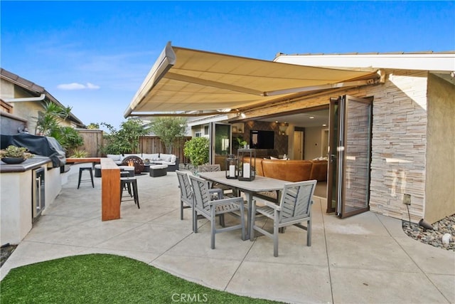 view of patio / terrace with outdoor lounge area and grilling area