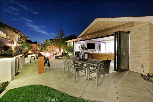 view of patio / terrace with a grill and exterior kitchen