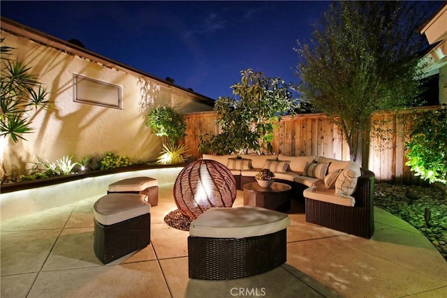 patio at twilight with an outdoor hangout area