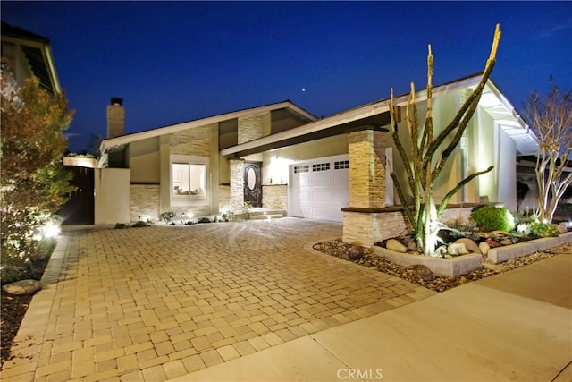 view of front of home with a garage