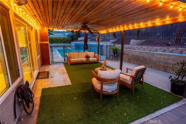 view of patio featuring ceiling fan and an outdoor living space