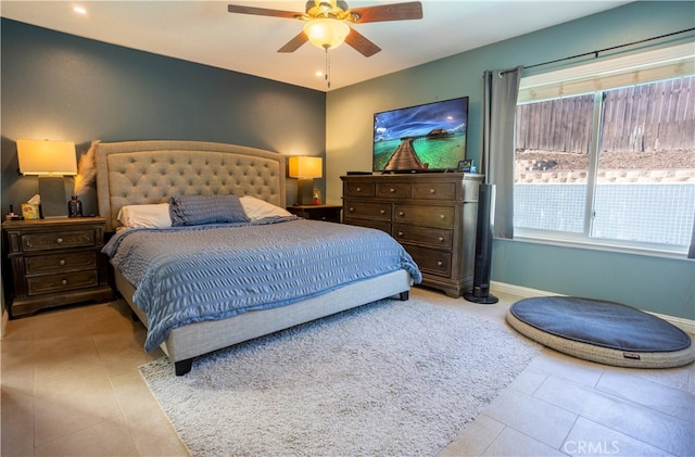 bedroom featuring light tile patterned flooring and ceiling fan