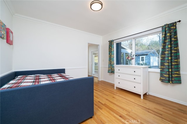 bedroom featuring crown molding and hardwood / wood-style floors