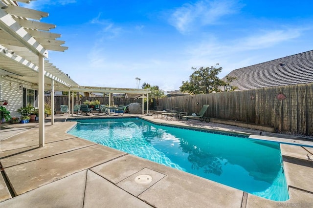 view of pool featuring a diving board, a patio area, and a pergola