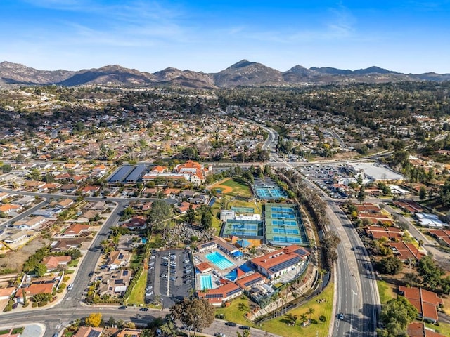 birds eye view of property with a mountain view