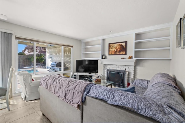 living room featuring light tile patterned flooring and a fireplace