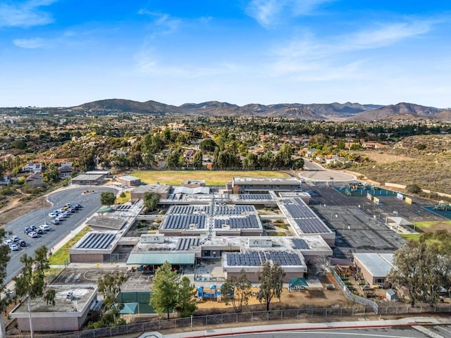 birds eye view of property with a mountain view