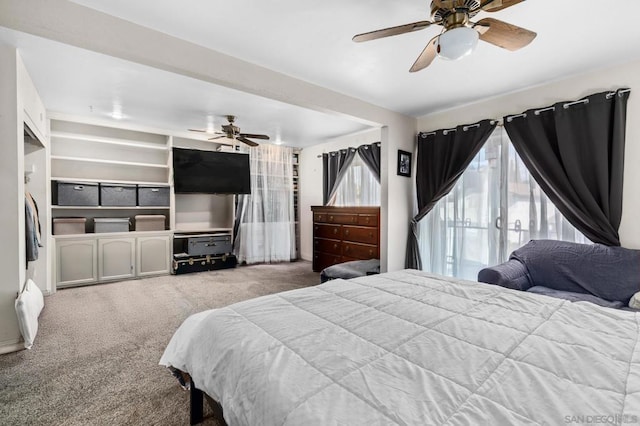 bedroom featuring ceiling fan and light colored carpet