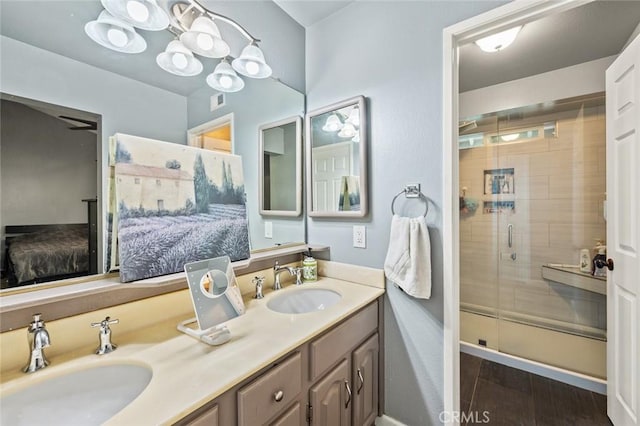 bathroom featuring vanity, hardwood / wood-style flooring, and walk in shower