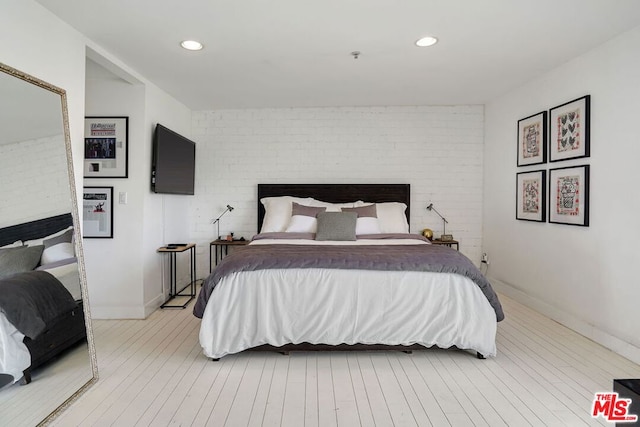 bedroom with brick wall