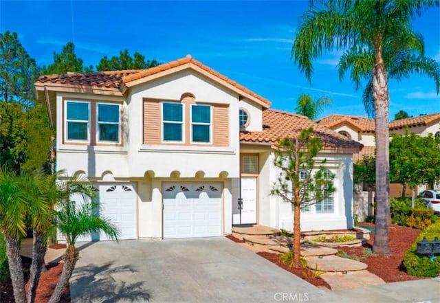 mediterranean / spanish-style home featuring a garage