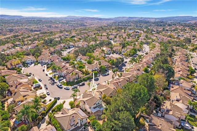 birds eye view of property with a mountain view