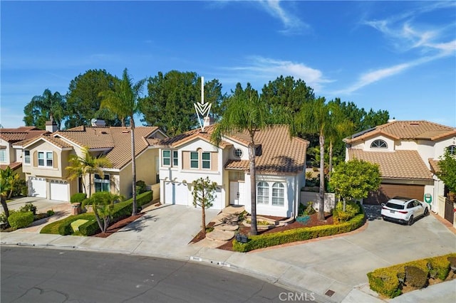 mediterranean / spanish home featuring a garage