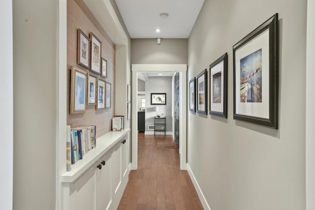 hall with dark hardwood / wood-style floors