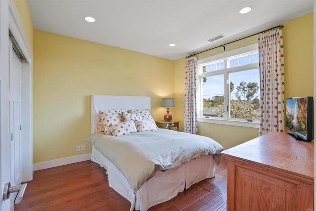 bedroom featuring dark hardwood / wood-style flooring