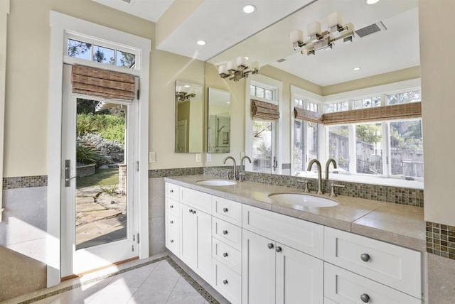 bathroom with tile patterned flooring and vanity