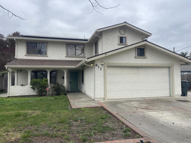 front of property with a garage and a front yard